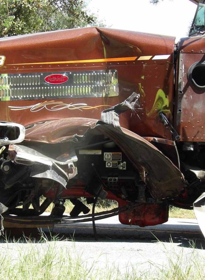 Front-end damage to a tractor