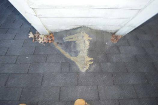 Chimney flashing on an asphalt shingle roof